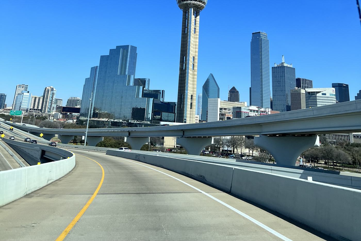 Highway ramp leading toward the downtown Dallas skyline